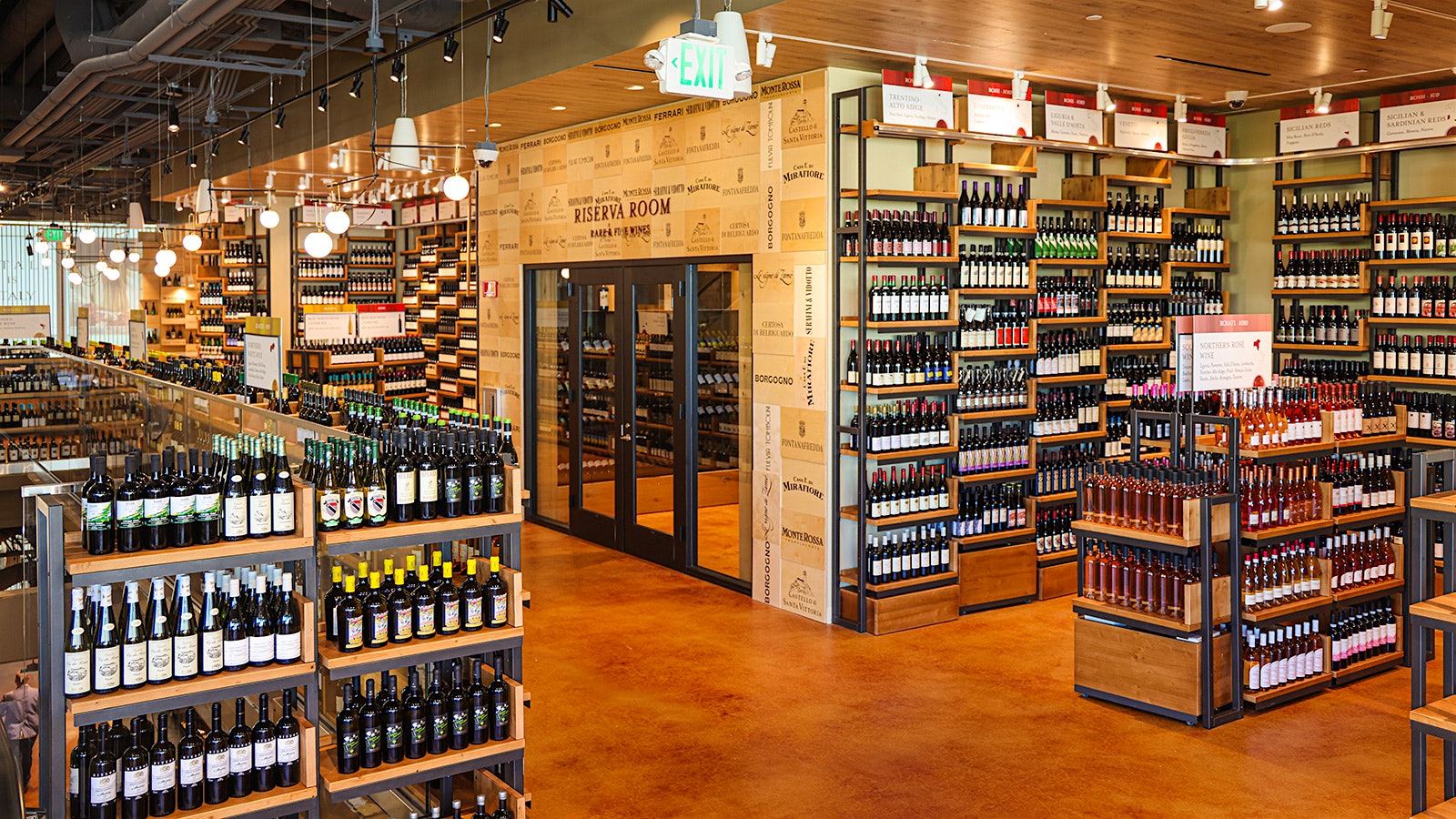 The wine shop at Eataly Silicon Valley with walls of bottles and a separate reserve-wine room